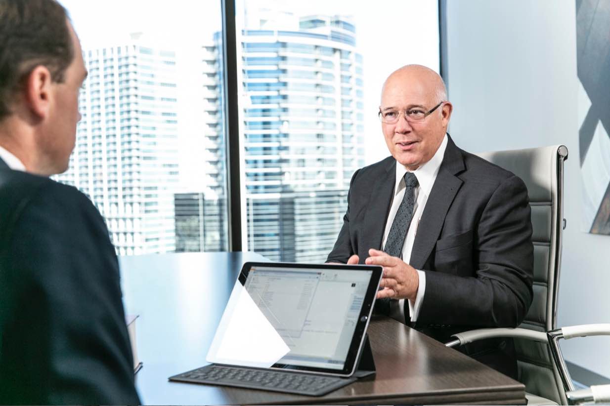 Lawyers reviewing data at a conference table